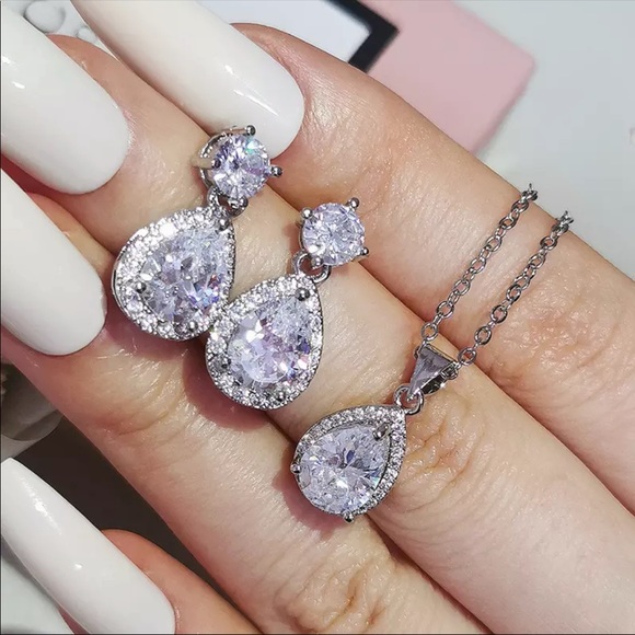 Silver solitaire engagement earring and necklace